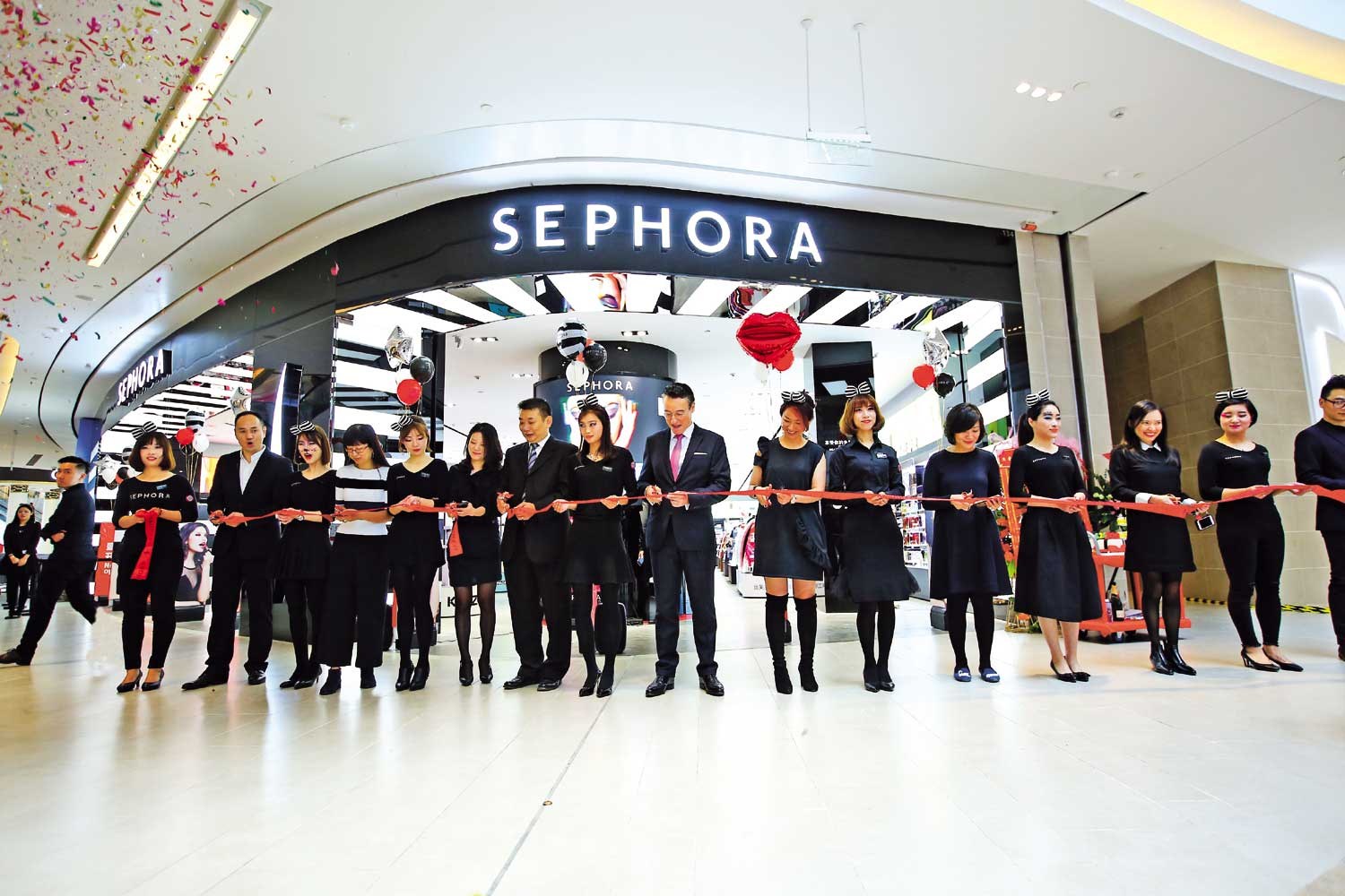 FILE--Pedestrians walk past a store of Sephora in Shanghai, China
